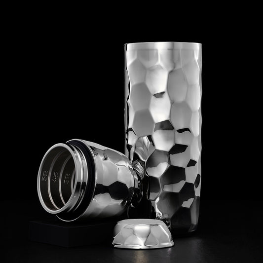 Silver/Chrome hexclad cocktail shaker open displaying the geometric pattern on a black background